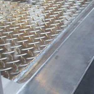 Flat washout plate shown slightly below trailer floor