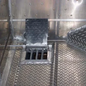 Drain door opened from the exterior of the trailer