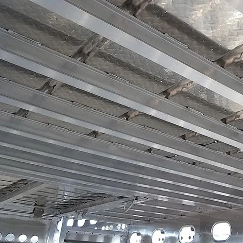 A closeup interior view of the hole punches on Merritt livestock trailers