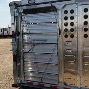A metal roll-up door placed on the left side of the back trailer wall.